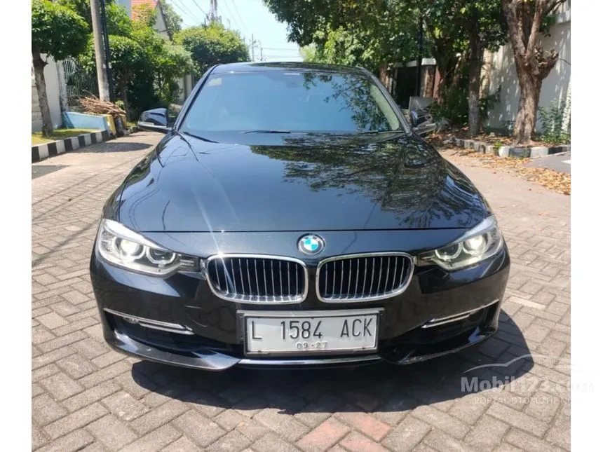 Jual Mobil BMW 320i 2013 Luxury 2.0 di Jawa Timur Automatic Sedan Hitam Rp 297.000.000