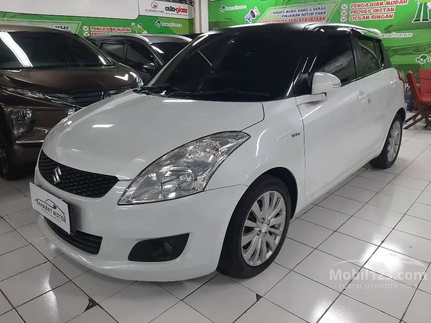 Jual Mobil Suzuki Swift 2014 GX 1.4 di Jawa Timur Automatic Hatchback Putih Rp 145.000.000
