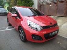 2013 KIA Rio 1.4 UB Hatchback Merah Cantik Siap Pakai