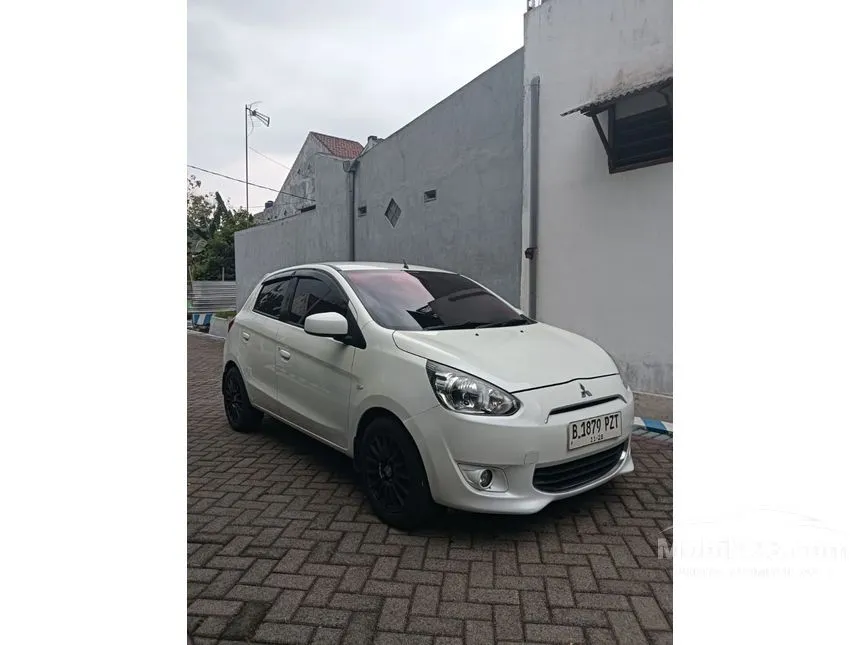 Jual Mobil Mitsubishi Mirage 2013 EXCEED 1.2 di Jawa Timur Automatic Hatchback Putih Rp 95.000.000